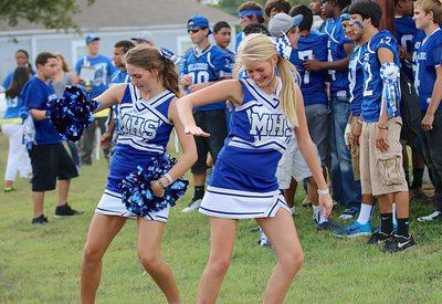 Image: Bulldog Cheerleaders Gabby Rose and Evy Ewing get in the groove during the pep rally in the park.