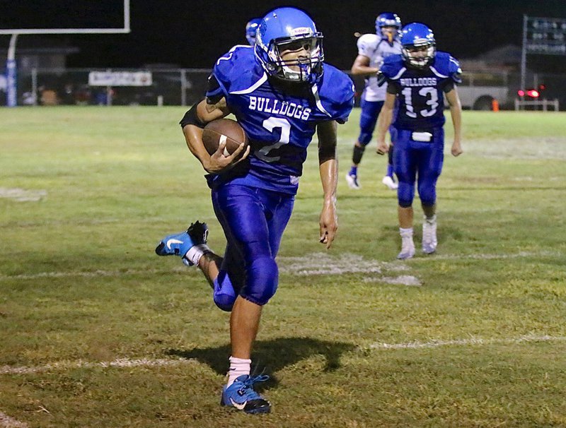 Image: Bulldog senior TraVion Jones(2) races toward the endzone.