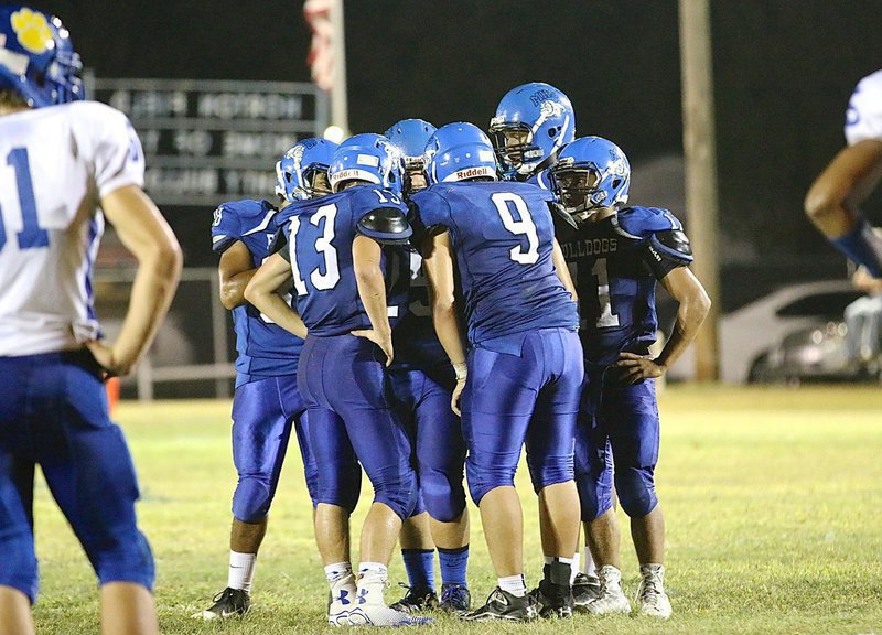 Image: The Bulldog offense keeps secrets from the Oakwood defense.