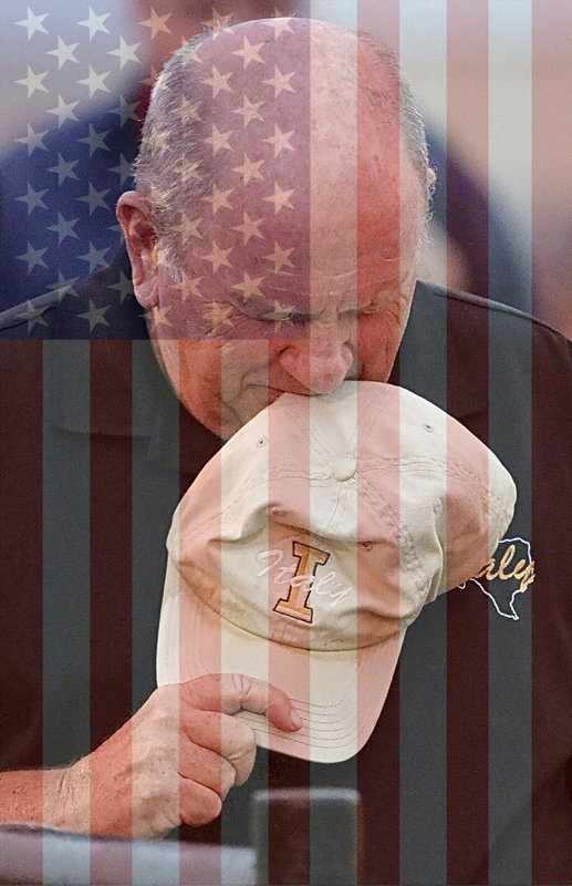 Image: HONORING ALL WHO SERVED — The students and faculty at Italy High School will have their Veterans Day Program in the George E. Scott Coliseum on Tuesday, November 11, 2014 at 9:00 a.m. All veteran’s and community members are welcomed to attend.
    Clutching his Italy coaching cap during the National Anthem is Navy veteran Johnny Jones.