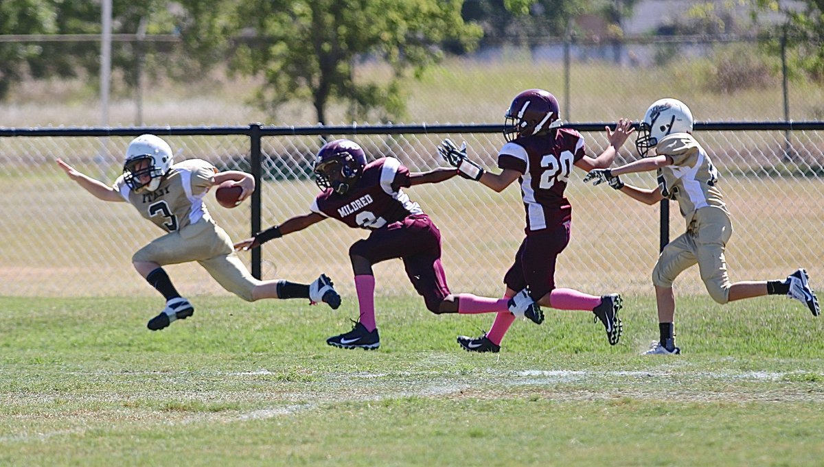 Image: IYAA A-team Gladiator Ty Cash(3) strectches for every inch he can get after a long run.