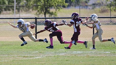 Image: IYAA A-team Gladiator Ty Cash(3) strectches for every inch he can get after a long run.