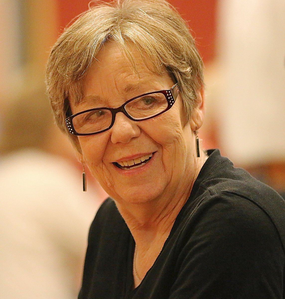 Image: Linda Goodman visits with friends while supporting the scholarship fundraiser.