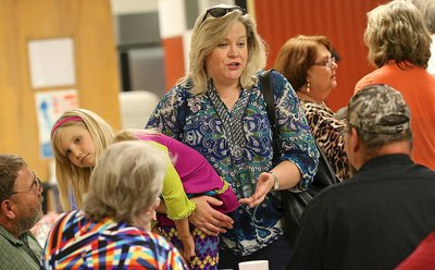 Image: Susan Wolaver and daughter Hannah visit with family and friends in the cafeteria.