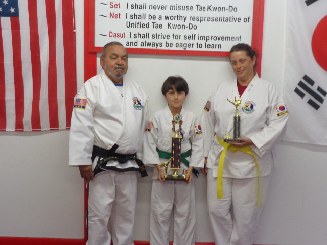 Image: Pictured is Master Charles Kight, Chief Instructor for 18 years, Antonio Procopio with his 1st place trophy and Jennifer with her 2nd place trophy.
