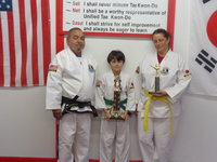 Image: Pictured is Master Charles Kight, Chief Instructor for 18 years, Antonio Procopio with his 1st place trophy and Jennifer with her 2nd place trophy.