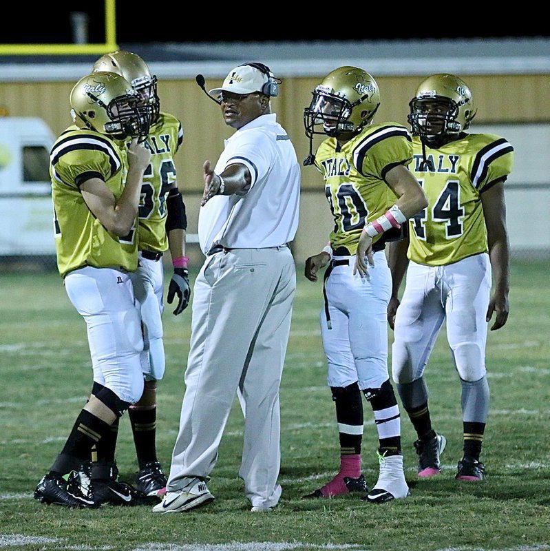 Image: Assistant coach Bobby Campbell talks with his special teams unit with Clay Riddle(77), David De La Hoya(56), Jack Hernandez(80) and Jaray Anderson(44) listening up.