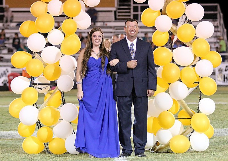Image: Homecoming Queen Nominee Reagan Cockerham, a senior, is escorted by her father, Paul Cockerham.
