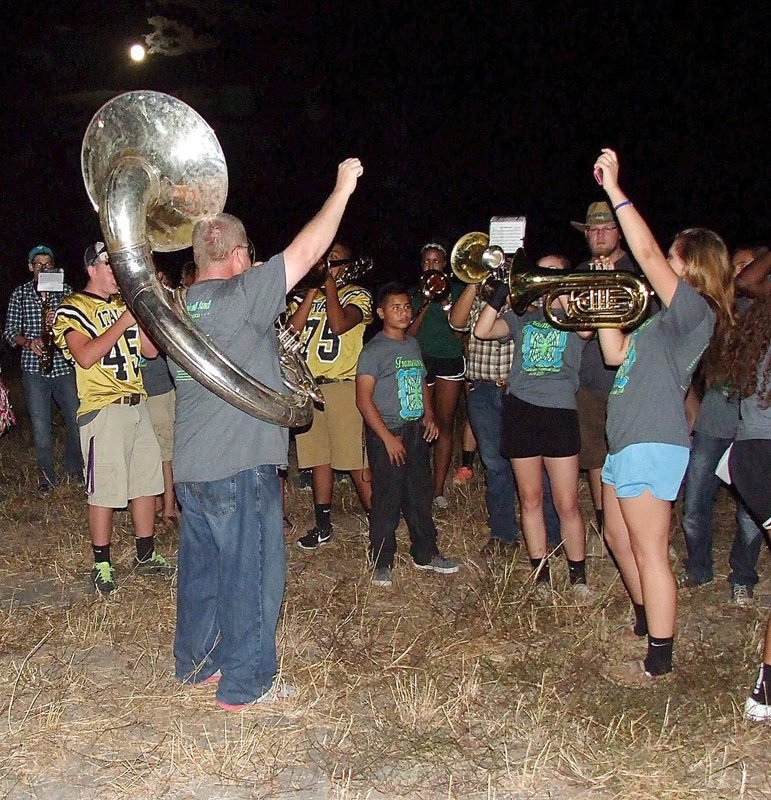 Image: Assistant band director David Graves and Lillie Perry are pumped to end a song.