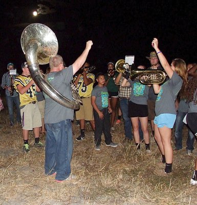 Image: Assistant band director David Graves and Lillie Perry are pumped to end a song.
