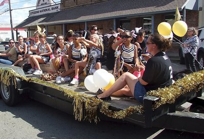 Image: The IYAA A-team cheerleaders add their personal touch to the homecoming parade.