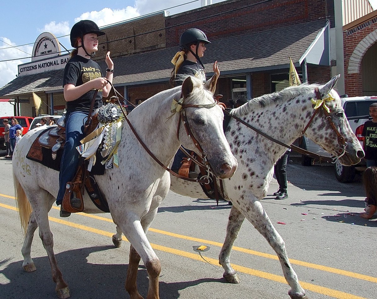 Image: Riders from Flying Dollar of Italy participate in the parade.