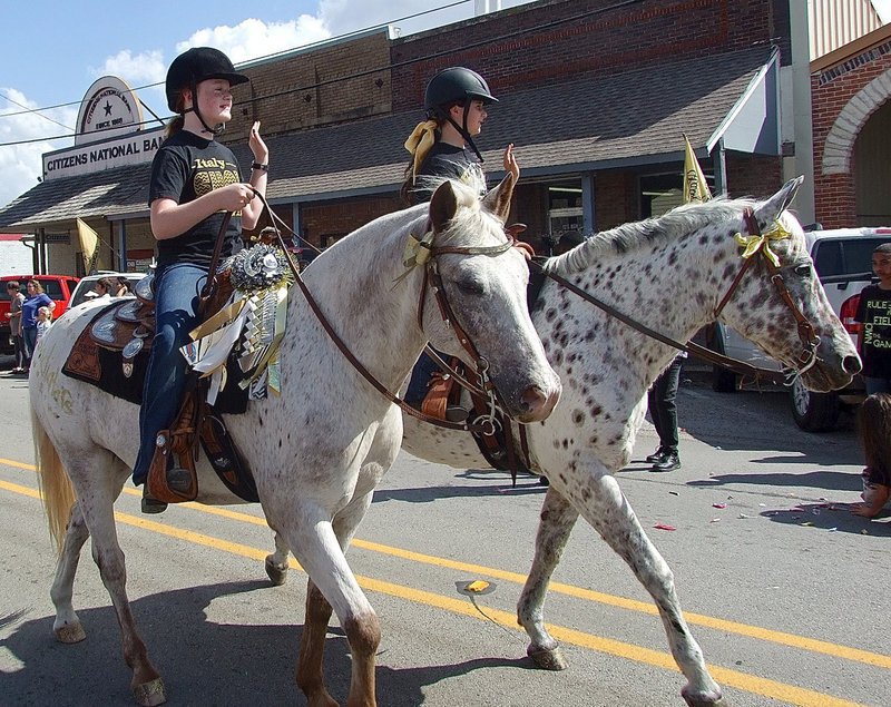 Image: Riders from Flying Dollar of Italy participate in the parade.
