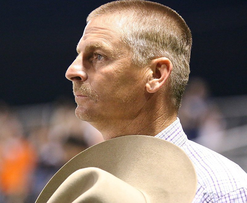 Image: Old goldl respecting old glory — 1990 Gladiator alumni Curtis Riddle(44) takes his hat off for the red, white and blue.