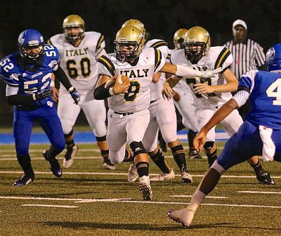 Image: Quarterback Joe Celis(8) finds running room against the speedy Chilton defense.