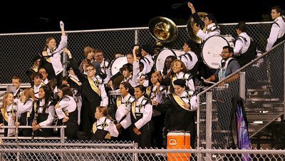 Image: The Gladiator Regiment Band cheers on their guys in gold.
