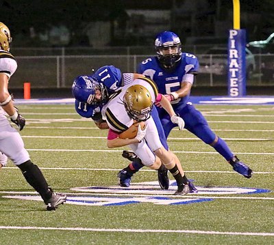 Image: Gladiator receiver Clayton Miller(6) pulls in a pass from teammate Joe Celis.