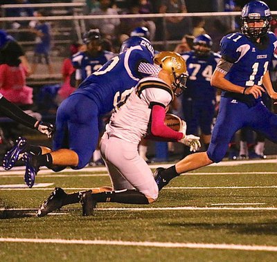 Image: Italy’s Clayton Miller(6) gets hogtied by a Pirate tackler during a kick return.