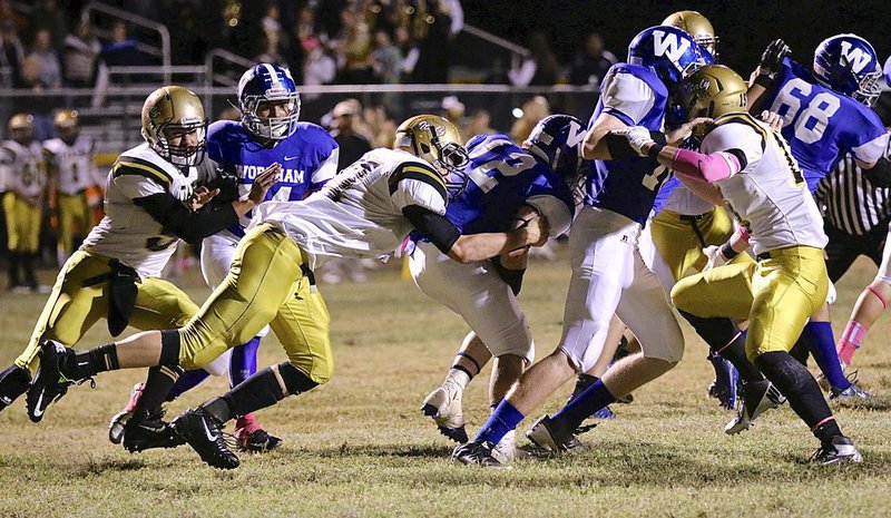 Image: Clay Riddle(77) finishes of the tackle for Italy.