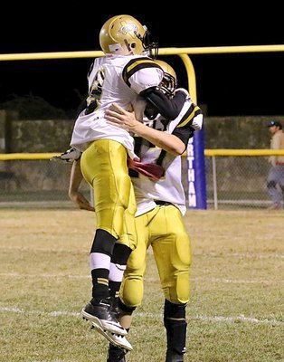 Image: After penning the Bulldogs deep with a punt, freshman punter Gary Escamilla(9) celebrates with fellow freshman Clay Riddle(77).