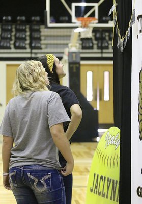 Image: Jaclynn and Megann check out photos of Jaclynn and her team in action over the past three seasons.