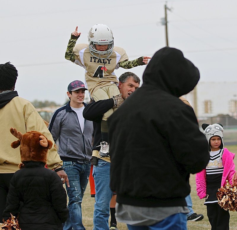 Image: Gared Wood(4) gets a heroes shoulder ride from dad and coach Gary Wood after Italy defeated Palmer in the Superbowl. Gared Wood accounted for 5 of Italy’s 6 touchdowns including 2 kickoffs returned for scores, 1 in each half.