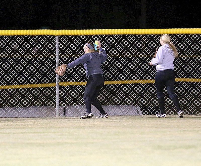 Image: Hannah Washington hurries the ball in for Italy after a hit into left field.