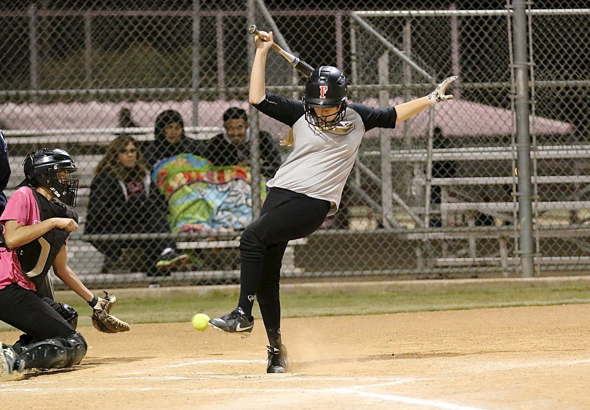 Image: Italy’s Brycelen Richards is hit by a pitch and allowed to take first base.