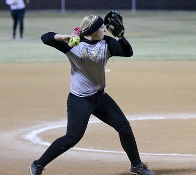 Image: Jaclynn Lewis covers a grounder back to the mound and then throws to first-base for the out, stranding two South Grand Prairie base runners in the bottom of the fourth-inning.