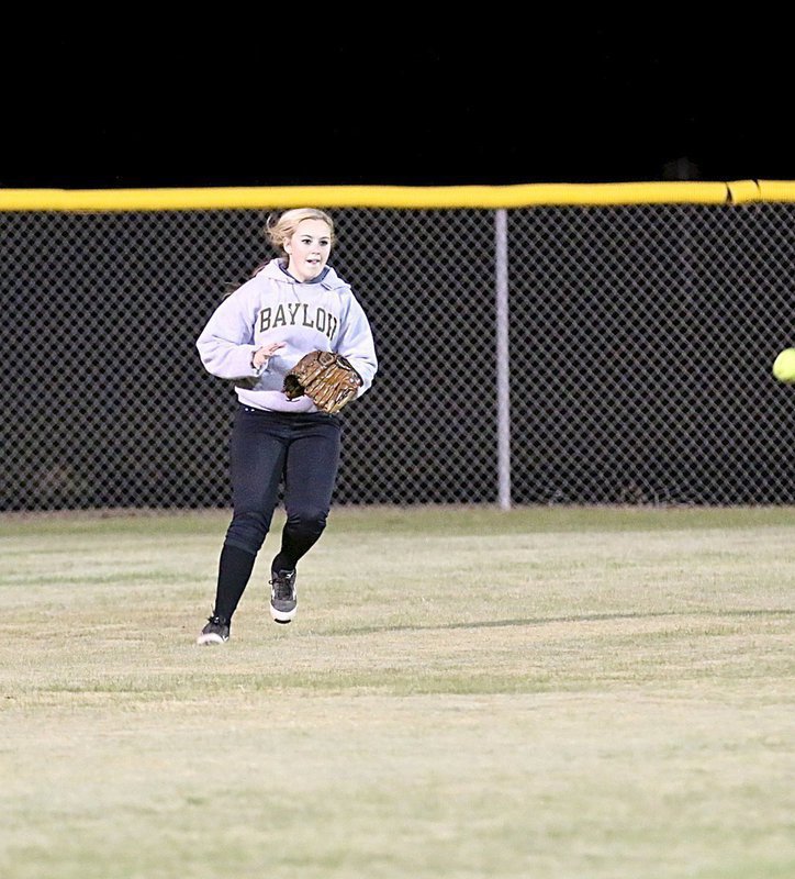 Image: Italy’s Kelsey Nelson makes a play on a ball hit into centerfield.