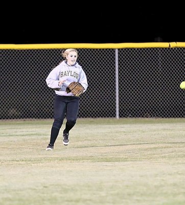 Image: Italy’s Kelsey Nelson makes a play on a ball hit into centerfield.