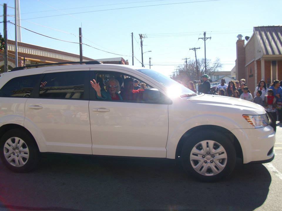 Image: Grand Marshall, Altha McNeely, leads the parade with driver, Brian Mathiowetz.