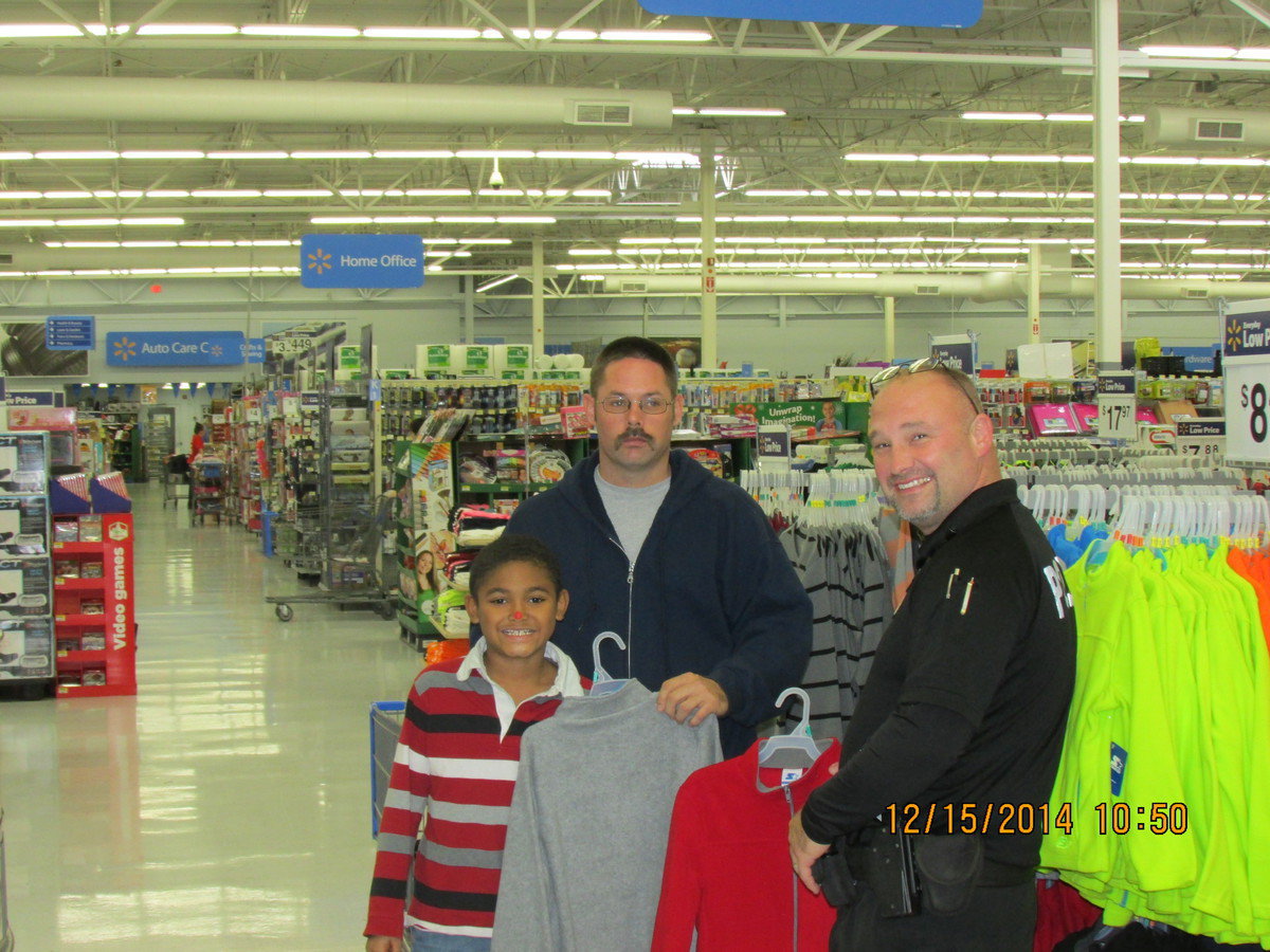 Image: Isaac, firefighter Kimmons and Officer Saxon