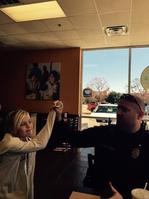 Image: Taylor giving Chief Martin a high five