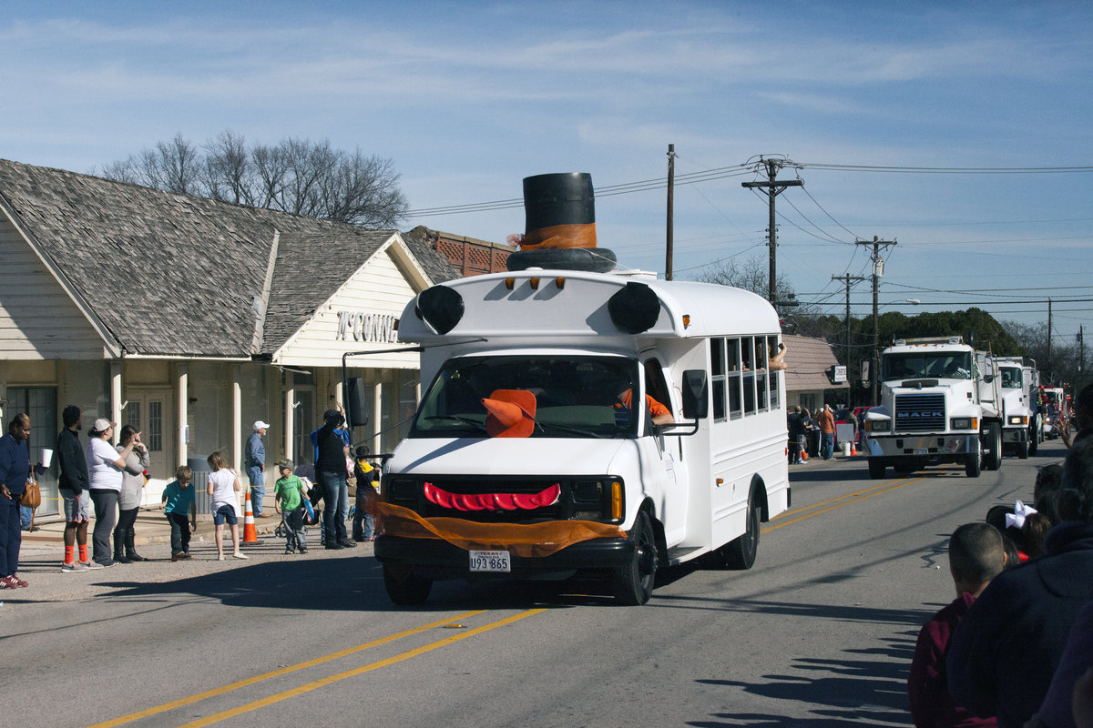 Image: A cleverly crafted snowman-mobile with a road cone for a nose.