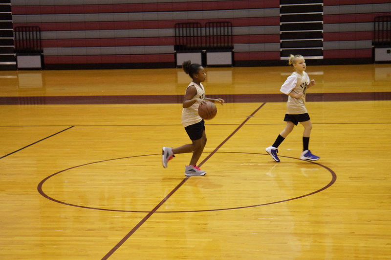 Image: Jada Williams takes the ball down the court for the Gladiators.