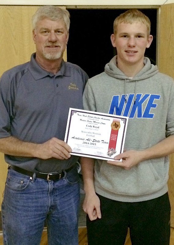 Image: Italy Gladiator senior Cody Boyd was chosen as an Honorable Mention member of the 2014-2015 Academic All-State Team as voted on by the Texas High School Coaches Association in conjunction with the United States Marine Corps. Boyd had a 3.207 GPA during his senior season and maintained a 92 GPA or higher throughout all four years of high school. Presenting Boyd with his certificate is Italy High School Athletic Director/Head Football Coach Charles Tindol.