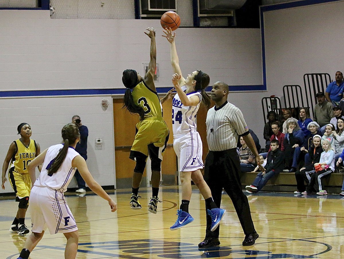 Image: Kortnei Johnson(3) wins the opening tip for Italy to set the tone for the Lady Gladiators and their eventual victory over Frost.