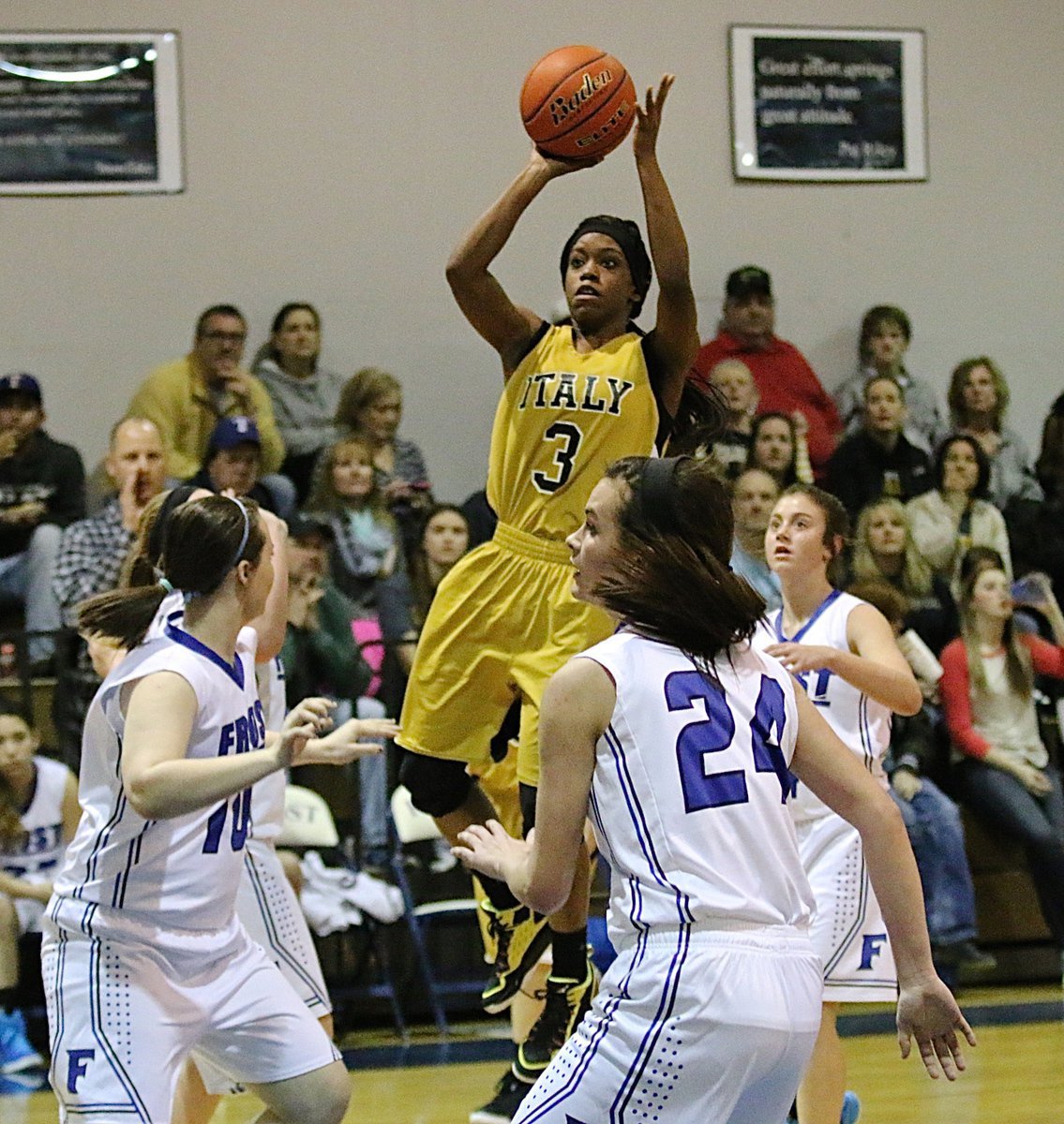 Image: Lady Gladiator senior Kortnei Johnson(3) finds clear sailing above the Frost defense.