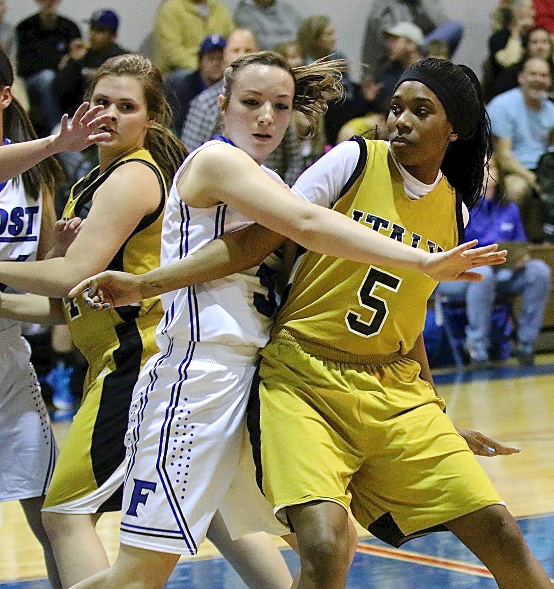 Image: Lady Gladiators Lillie Perry(24) and Janae Robertson(5) fight to get open with Italy inbounding the ball under their own basket.
