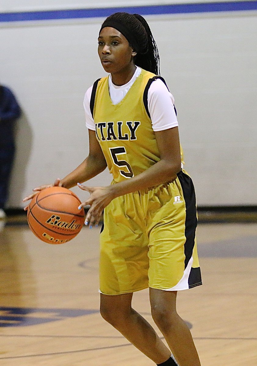 Image: Janae Robertson(5) keeps the ball moving during an offensive set for the Lady Gladiators.