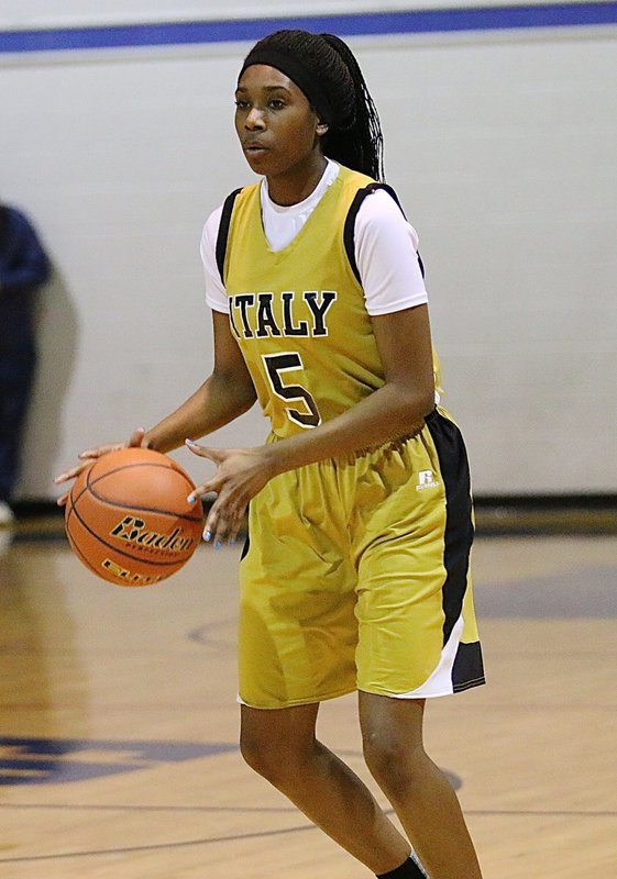 Image: Janae Robertson(5) keeps the ball moving during an offensive set for the Lady Gladiators.