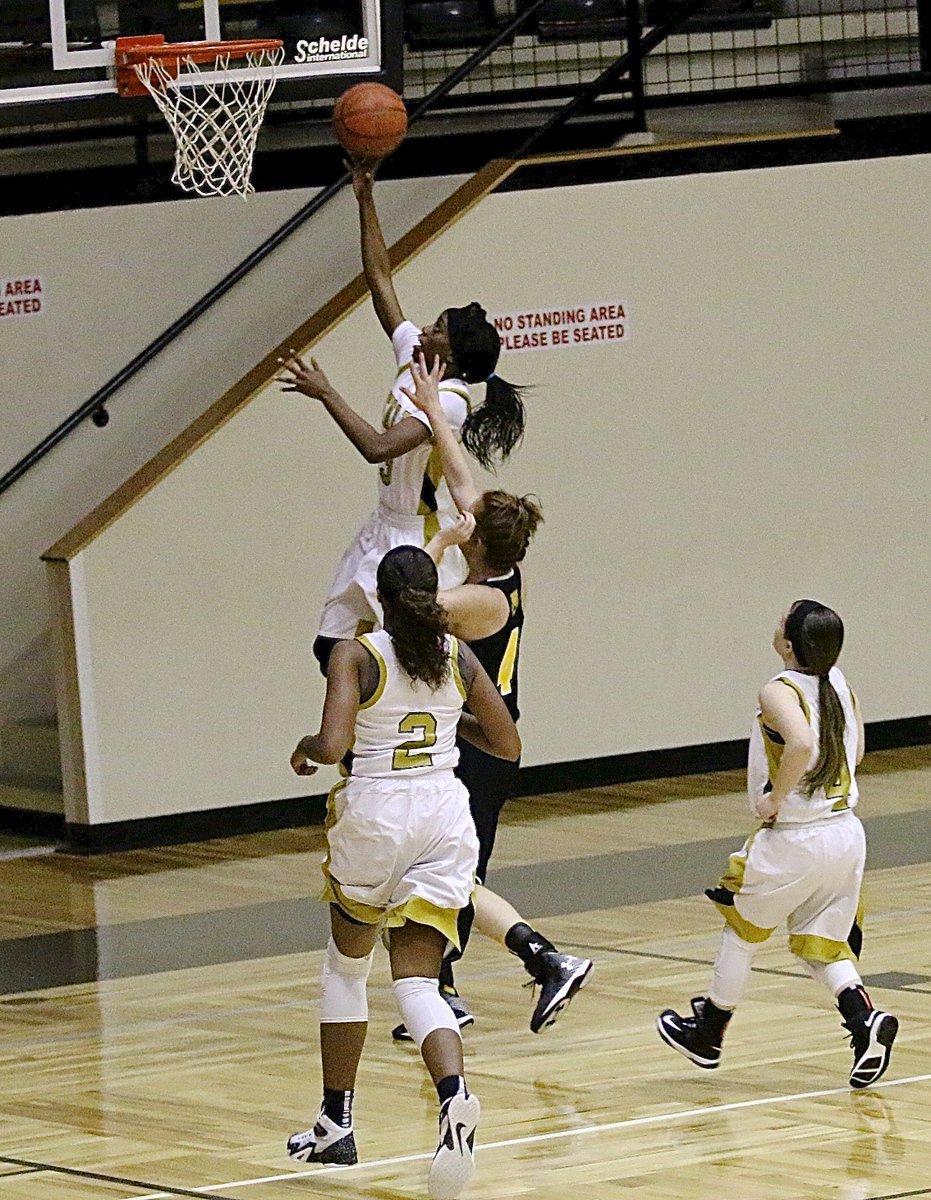 Image: Italy’s Kortnei Johnson(3) wins the race to the rim for 2-points with teammates Emmy Cunningham(2) and Tara Wallis(4) hustling down court to backup Johnson.