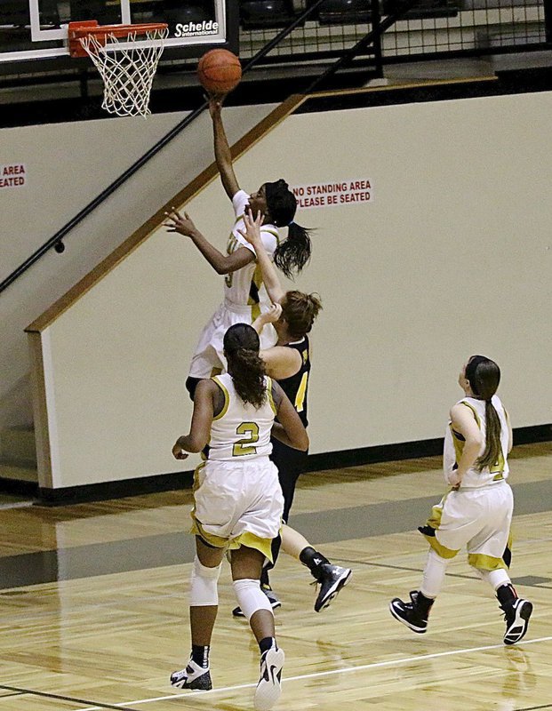 Image: Italy’s Kortnei Johnson(3) wins the race to the rim for 2-points with teammates Emmy Cunningham(2) and Tara Wallis(4) hustling down court to backup Johnson.