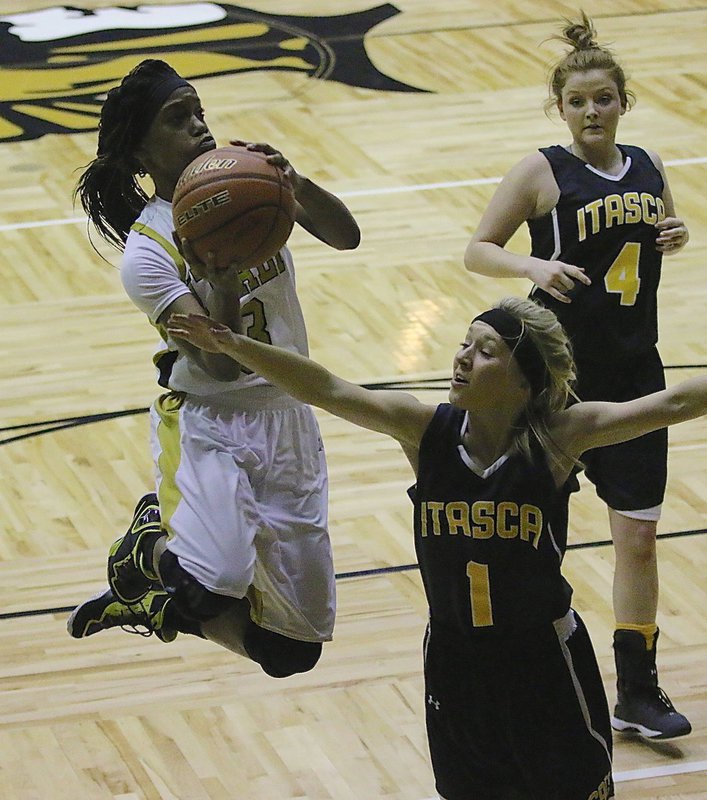 Image: Lady Gladiator Kortnei Johnson(3) floats to the basket with the greatest of ease.