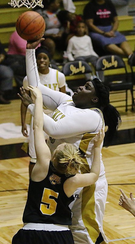 Image: Italy power center Cory Chance(33) draws a shooting foul under the basket.