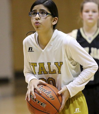 Image: Italy’s Andrea Galvan(20) returns to the foul line late in the game.