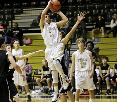 Image: JV Gladiator Gary Escamilla(2) drives into the lane for a bucket against Dawson in first-round tournament action.