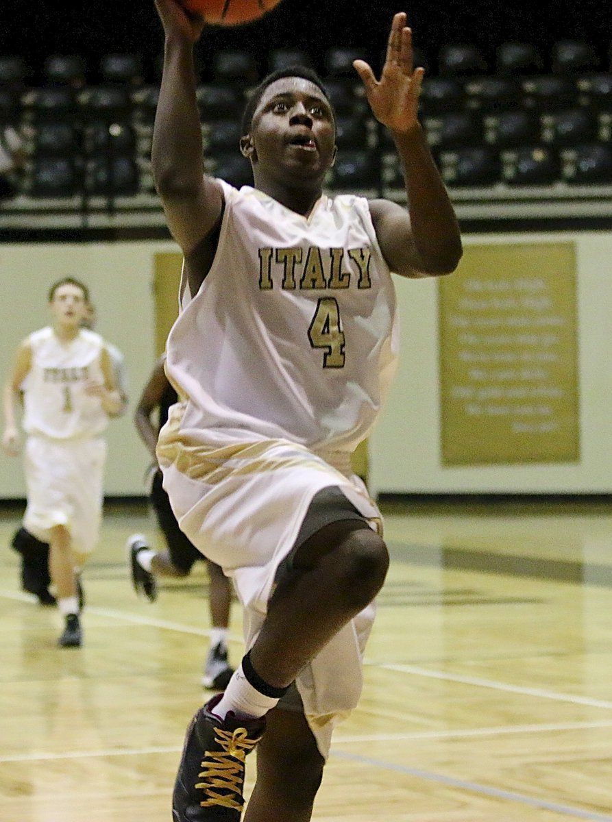 Image: Italy power forward Anthony Lusk(4) finishes the fast break against Dawson.