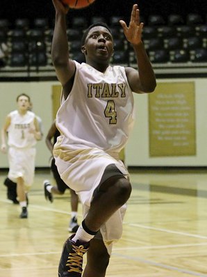 Image: Italy power forward Anthony Lusk(4) finishes the fast break against Dawson.